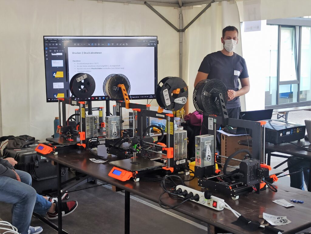 A Fab Lab employee explains about 3D printers